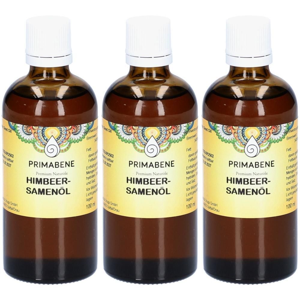 Drei Flaschen Himbeersamenöl von PRIMABENE mit weißem Schraubverschluss und gelbem Etikett.