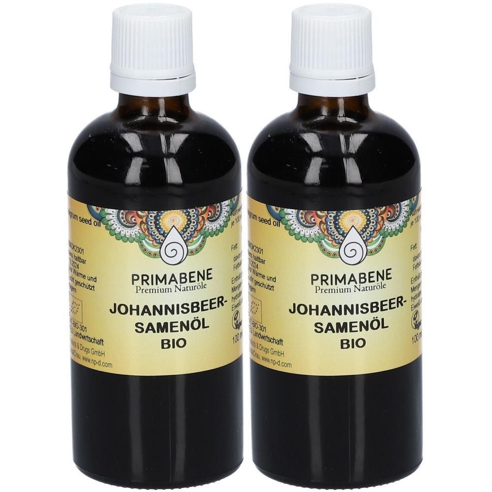 Zwei Flaschen PRIMABENE Johannisbeersamenöl BIO mit weißen Schraubverschlüssen. Gelbes Etikett mit Ornamenten und Produktinformationen.