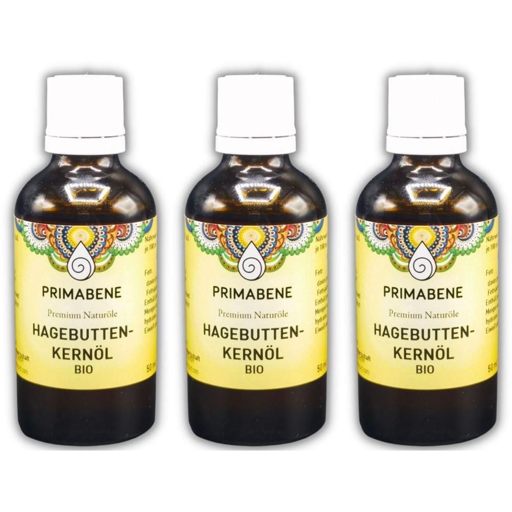 Drei Flaschen PRIMABENE Hagebuttenkernöl BIO, braunes Glas, weiße Kappe, gelbes Etikett mit floralem Muster.