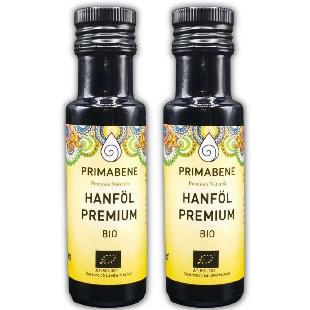 Zwei Flaschen PRIMABENE Hanföl Premium BIO mit schwarzem Schraubverschluss und gelbem Etikett.