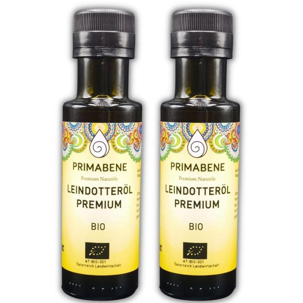 Zwei Flaschen PRIMABENE Leindotteröl Premium BIO mit schwarzem Schraubverschluss und gelbem Etikett.