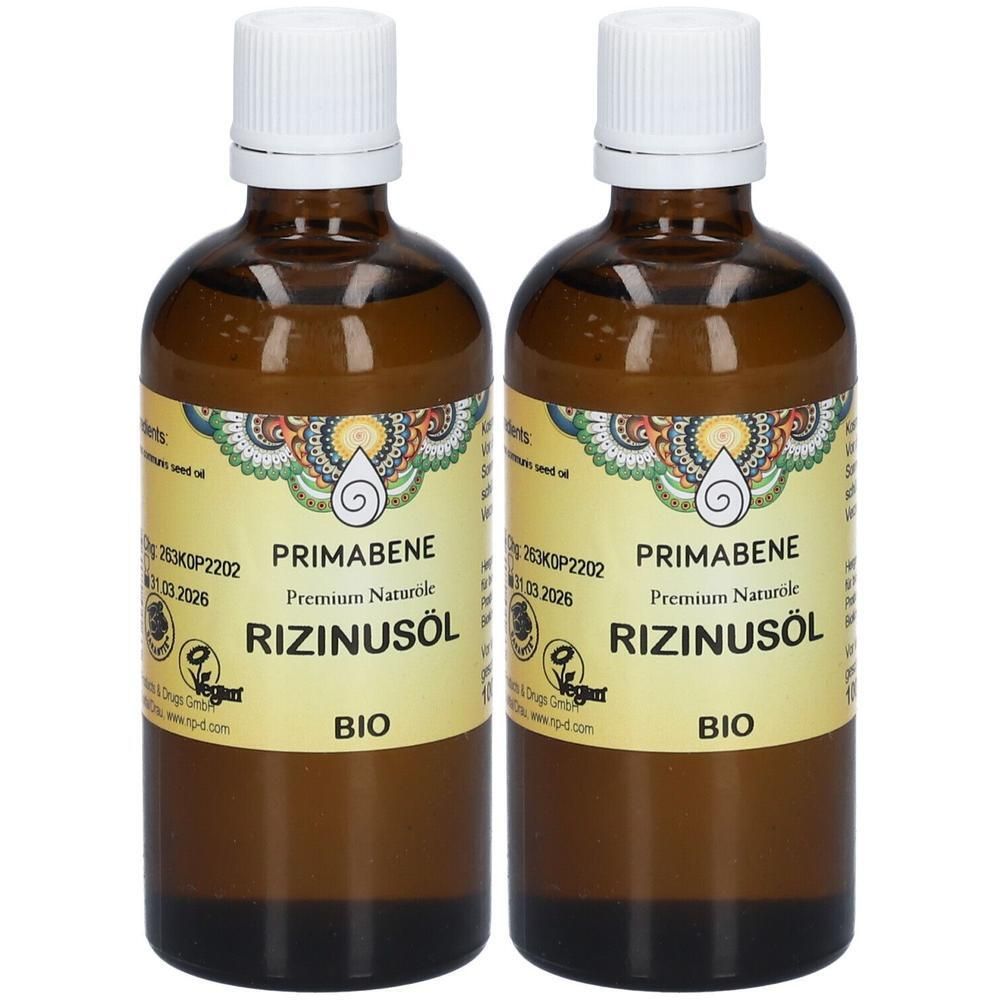 Zwei PRIMABENE Rizinusöl BIO Flaschen mit weißen Verschlüssen und gelben Etiketten.