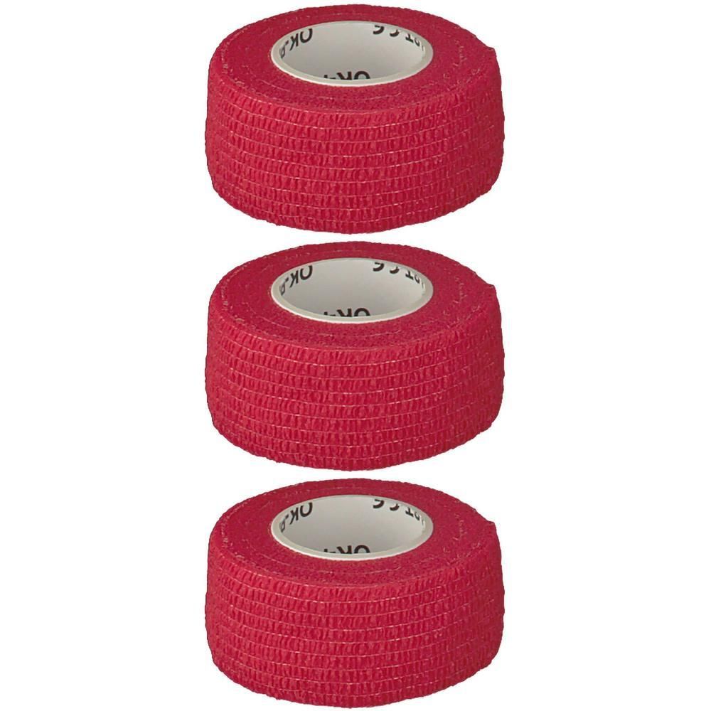 Drei rote Rollen selbstklebendes Verbandmaterial nebeneinander.