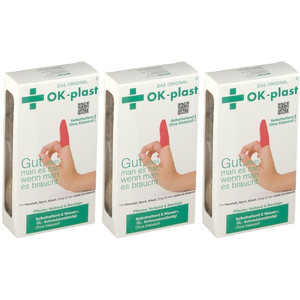 Drei Packungen OK-plast Fingerverband. Weiße Kartons mit grünen Kreuzen und rotem Fingerverband-Symbol.