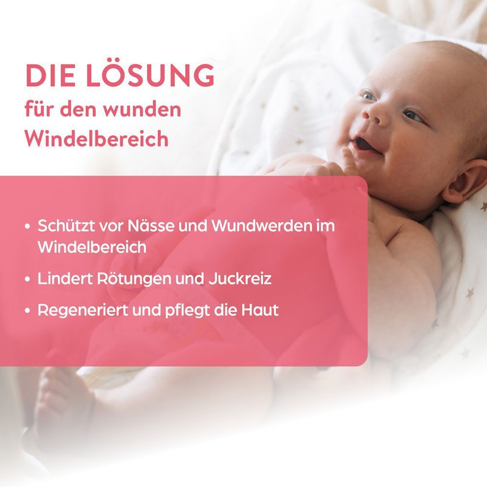 Ein Baby liegt auf einer Decke. Text: Die Lösung für den wunden Windelbereich. Schutz vor Nässe, lindert Rötungen, pflegt die Haut.
