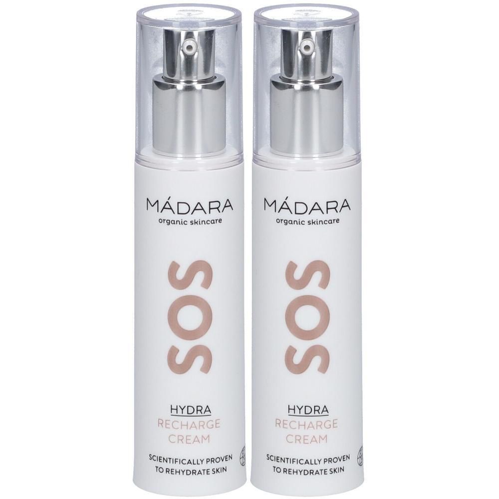 Zwei MÁDARA SOS Hydra Recharge Cream Pumpflaschen mit silbernen Applikatoren und klaren Kappen.