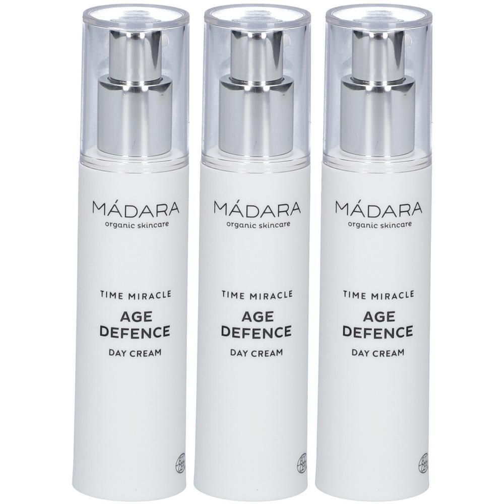 Drei weiße Pumpflaschen mit MÁDARA Time Miracle Age Defence Day Cream Beschriftung.