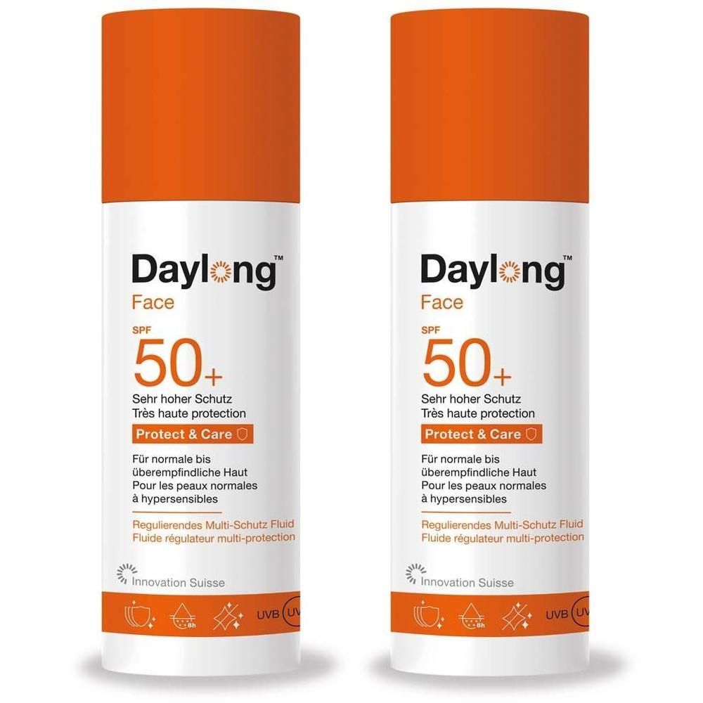 Zwei Flaschen Daylong Face SPF 50+ Protect & Care Sonnenschutzfluid mit orangefarbenen Verschlüssen.