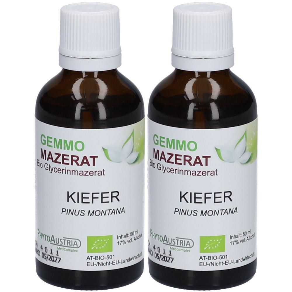 Zwei braune Glasflaschen mit weißem Schraubverschluss, gefüllt mit flüssigem Produkt. Etiketten zeigen 'GEMMO MAZERAT KIEFER'.