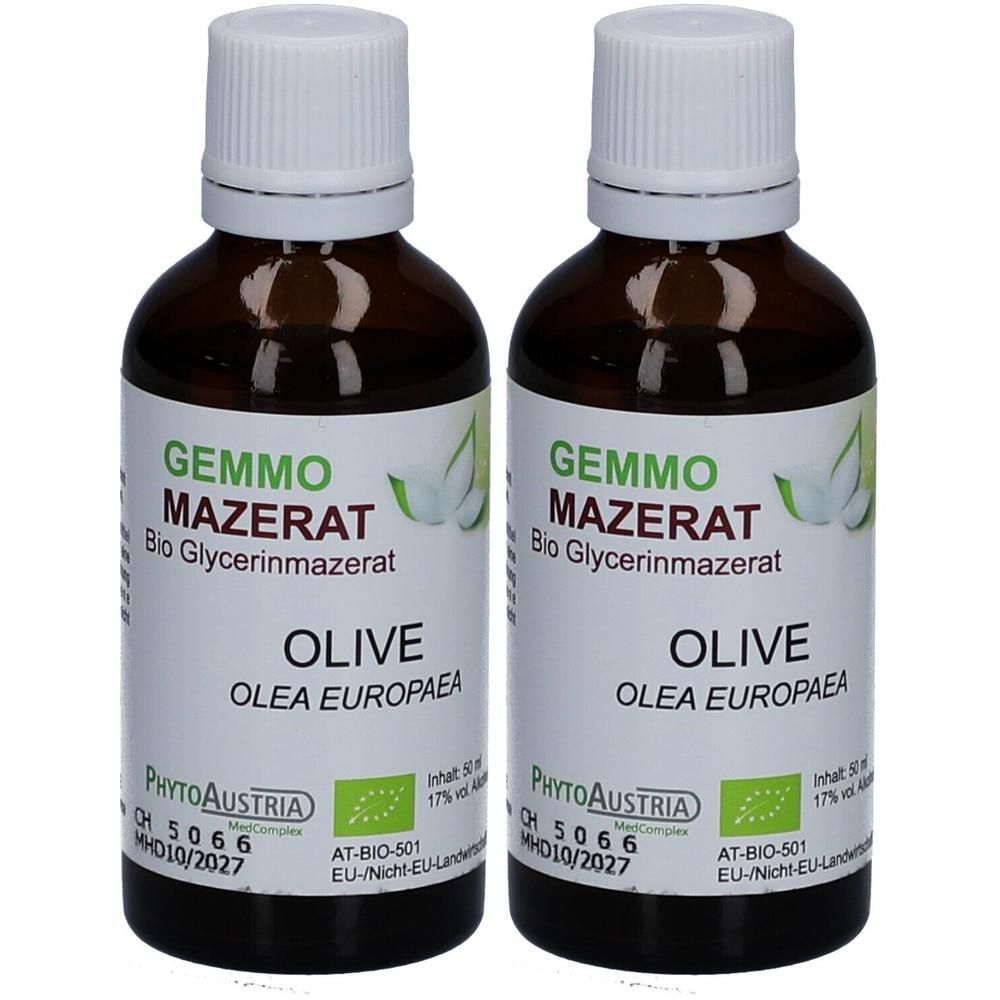 Zwei Flaschen GEMMO MAZERAT Bio Olivenöl-Glycerinmazerat. Dunkelbraune Glasflaschen mit weißen Verschlüssen.