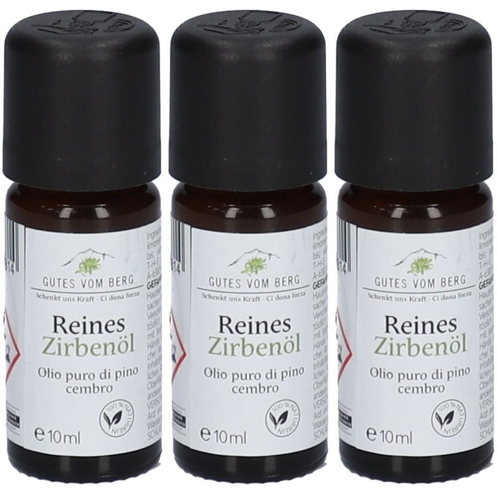 Drei Flaschen reines Zirbenöl mit schwarzen Schraubverschlüssen und Etiketten, die "GUTES VOM BERG" und "e 10ml" zeigen.
