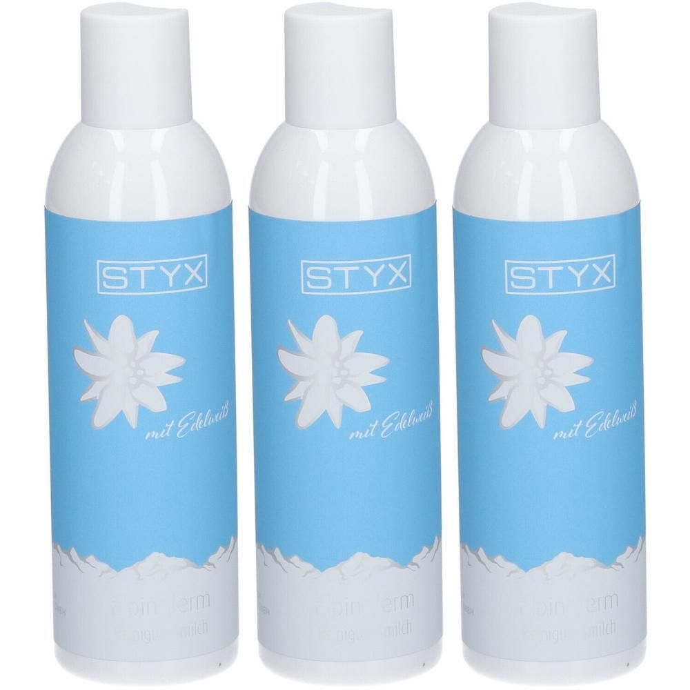 Drei weiße Flaschen mit blauem Etikett und Edelweiß-Motiv. STYX-Logo oben.