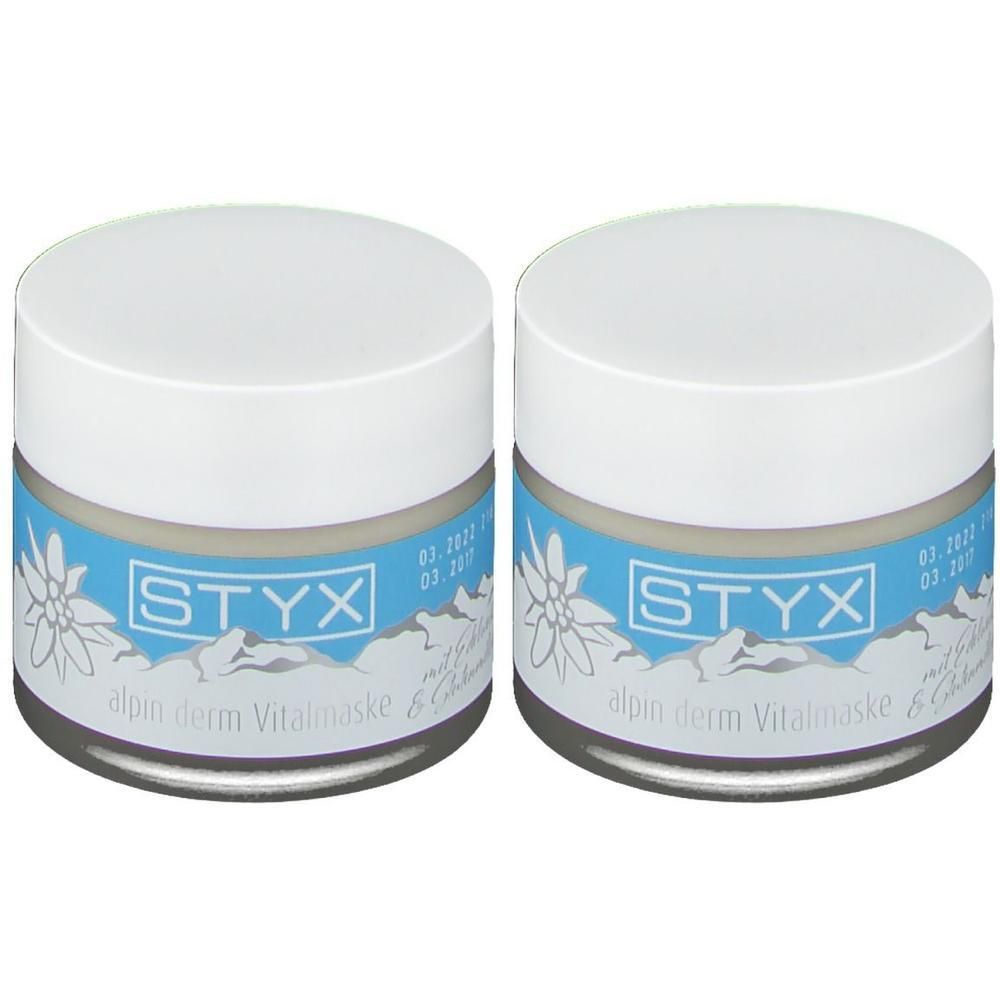 Zwei STYX alpin derm Vitalmaske Tiegel mit weißem Deckel und blauem Etikett mit Edelweiß-Motiv.