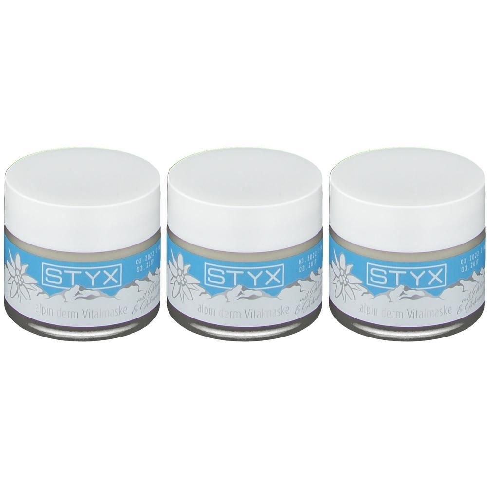 Drei weiße Tiegel mit blauem Etikett und Edelweiß-Motiv. Beschriftung: STYX alpin derm Vitalmaske.