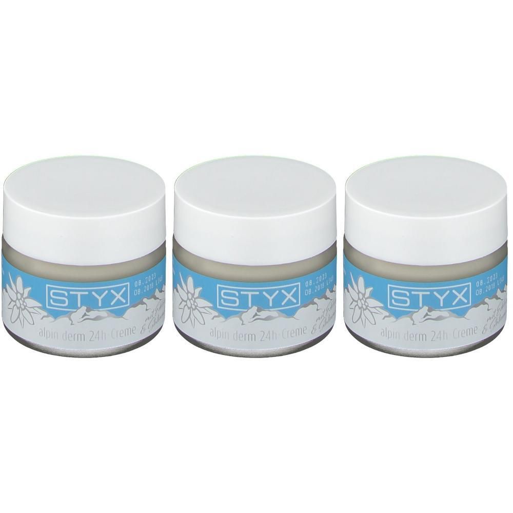Drei Gläser STYX alpin derm 24h-Creme mit Edelweiß-Motiv auf dem Etikett.