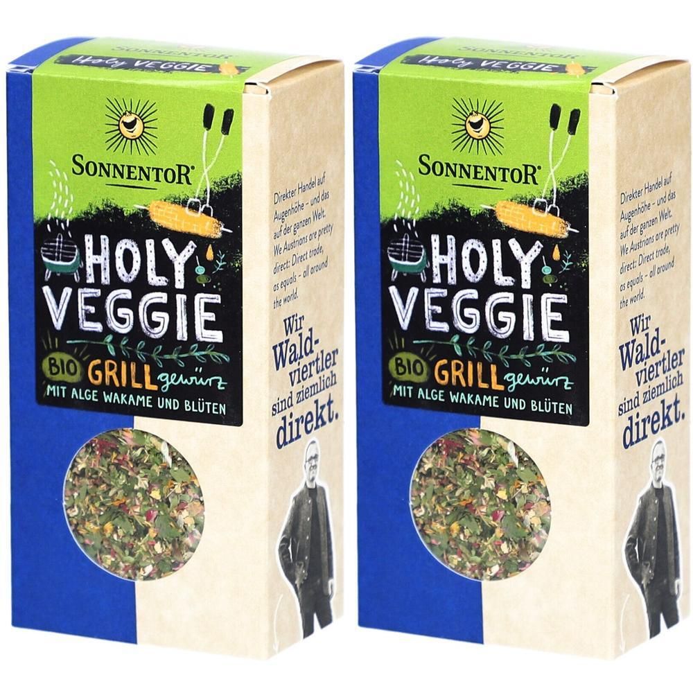 Zwei rechteckige Kartonverpackungen. Aufschrift: Holy Veggie Grillgewürz, Bio. Logo: Sonne. Inhalt: Kräutermischung.