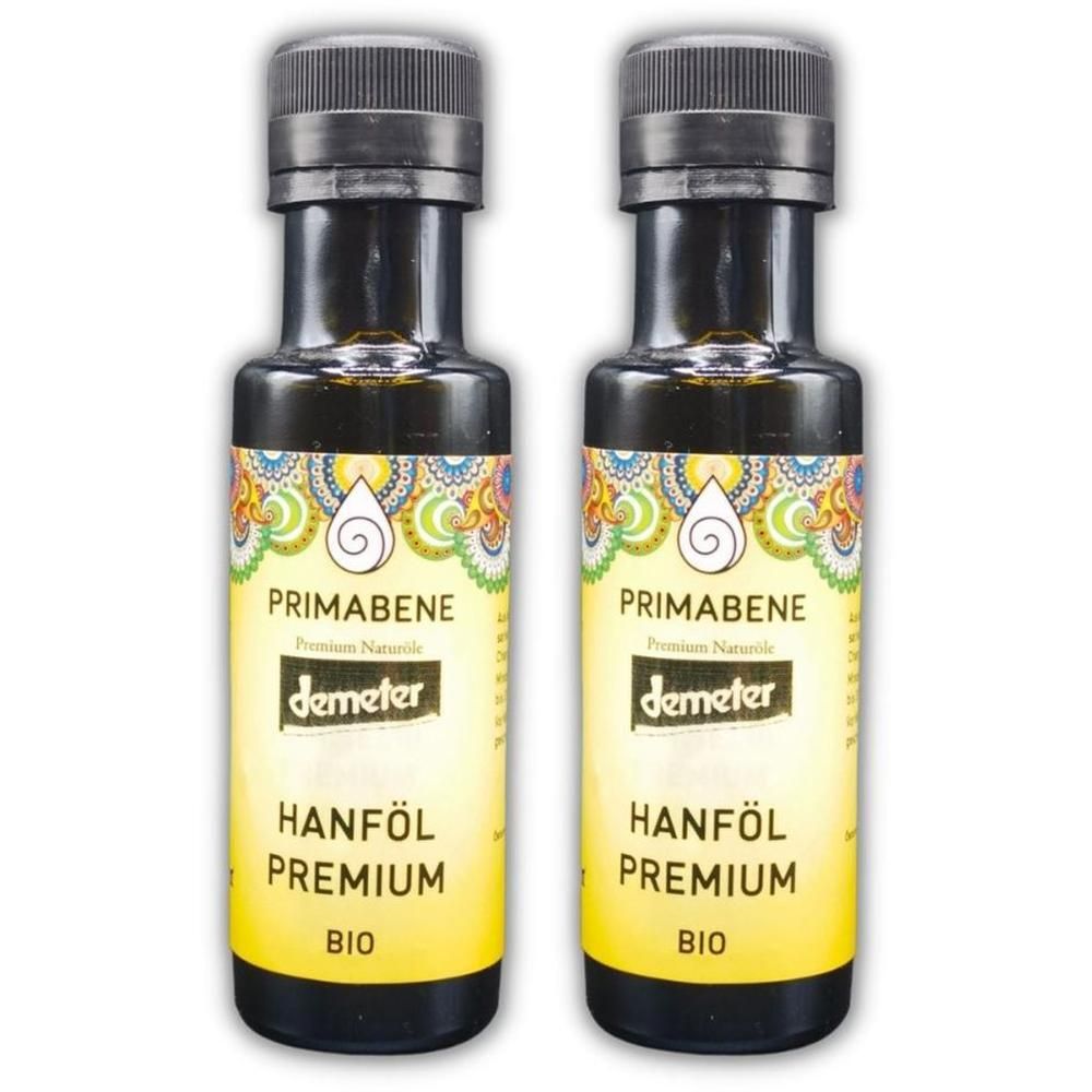 Zwei Flaschen PRIMABENE Hanföl Premium. Schwarze Flaschen mit gelben Etiketten. Demeter-Siegel. Aufschrift: Hanföl Premium BIO.