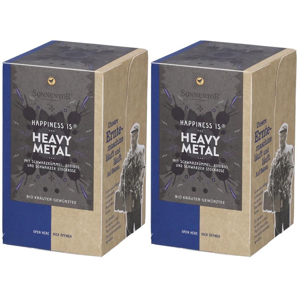 Zwei rechteckige Kartons mit dem Aufdruck "HAPPINESS IS HEAVY METAL" von SonnentoR. Aufschrift in Deutsch. Bio-Kräuter-Gewürztees.