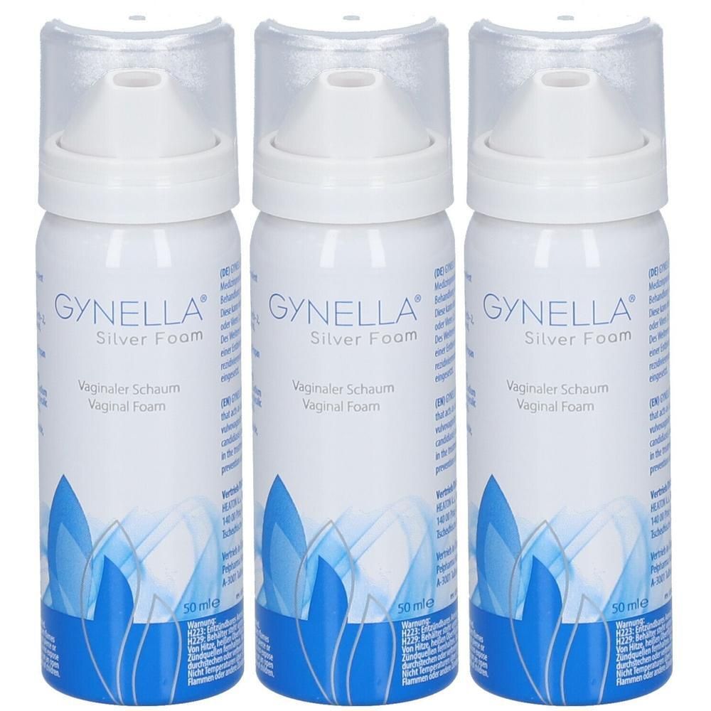 Drei weiße Aerosoldosen mit Applikatoraufsatz, beschriftet mit 'GYNELLA Silver Foam'.