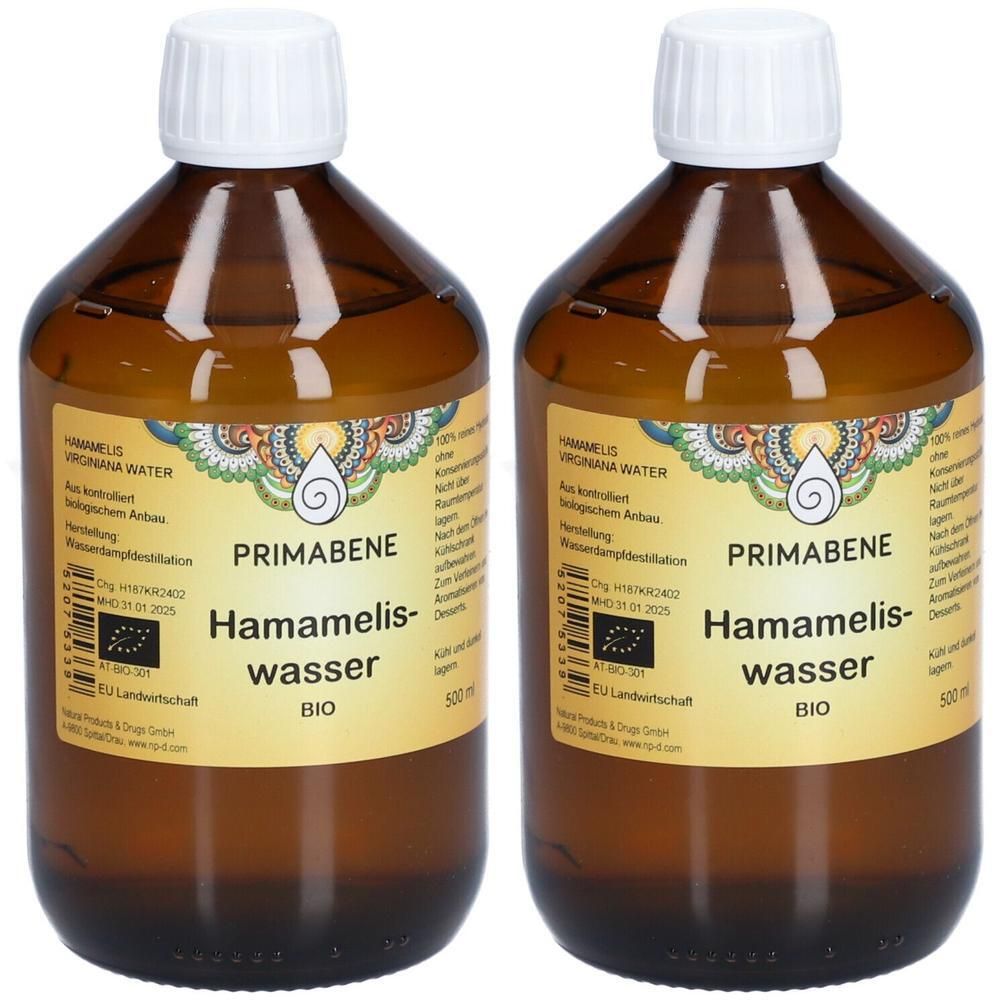 Zwei braune Glasflaschen mit weißem Deckel. Auf den Etiketten steht PRIMABENE Hamameliswasser BIO. EU-Bio-Logo.