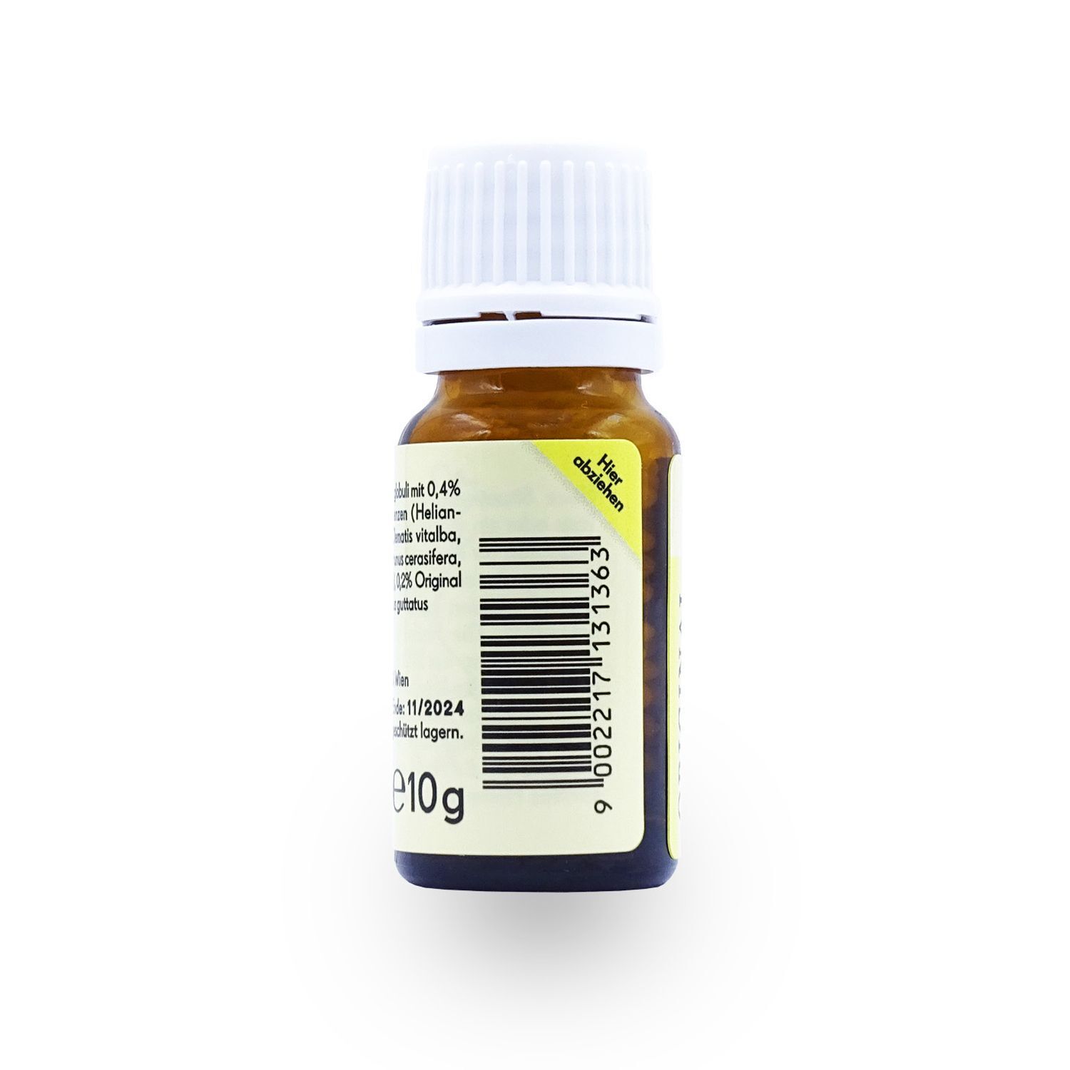 Rückseite einer braunen Glasflasche mit weißem Schraubverschluss. Gelbes Etikett mit Zutatenliste, Barcode und 10g Angabe.