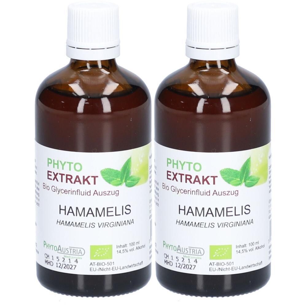 Zwei braune Glasflaschen mit weißem Deckel. Etikett mit Produktnamen, Logo und Zertifizierung. Aufschrift: PHYTO EXTRAKT HAMAMELIS.