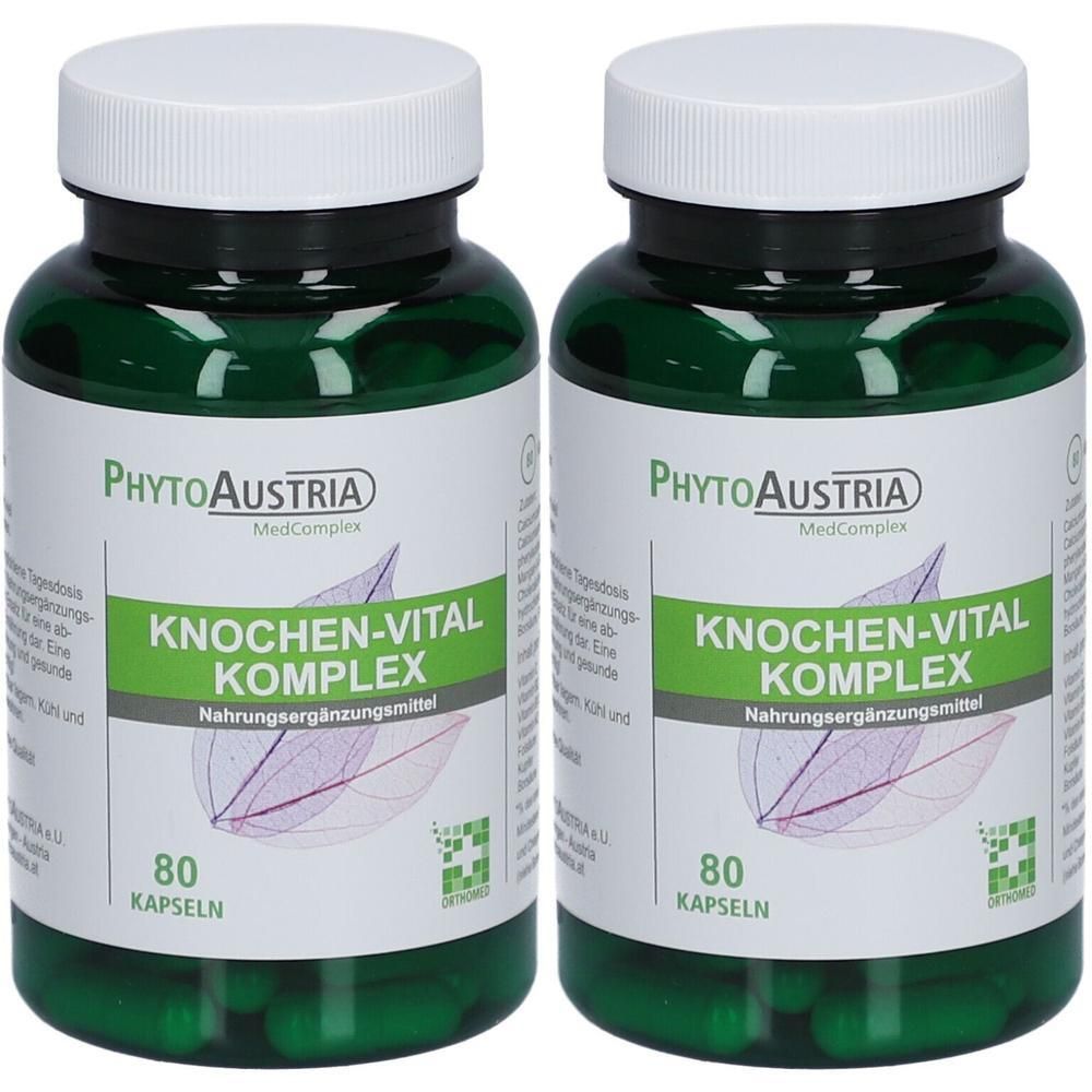 Zwei grüne Flaschen mit weißen Deckeln. Auf den Etiketten steht "KNOCHEN-VITAL KOMPLEX" und "80 KAPSELN". Marke: PhytoAustria.