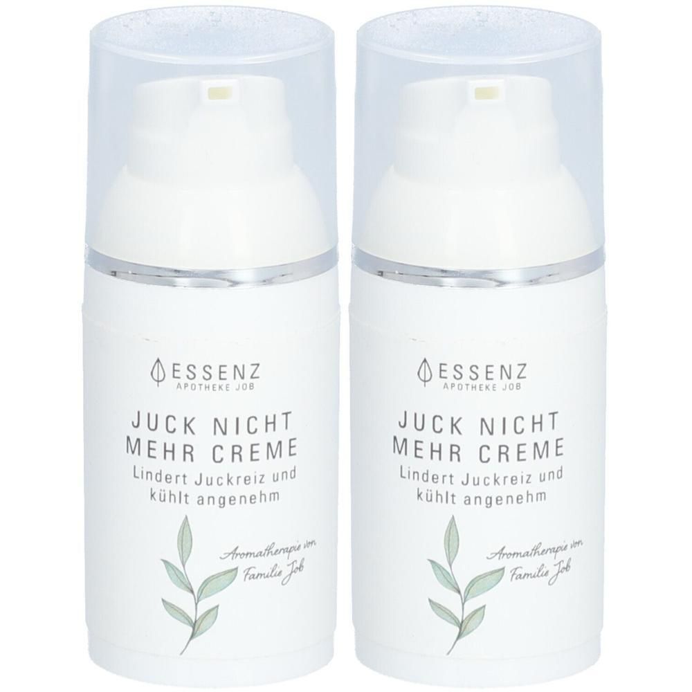 Zwei weiße Pumpspender mit silbernem Ring. Beschriftung: Essenz Juck Nicht Mehr Creme.