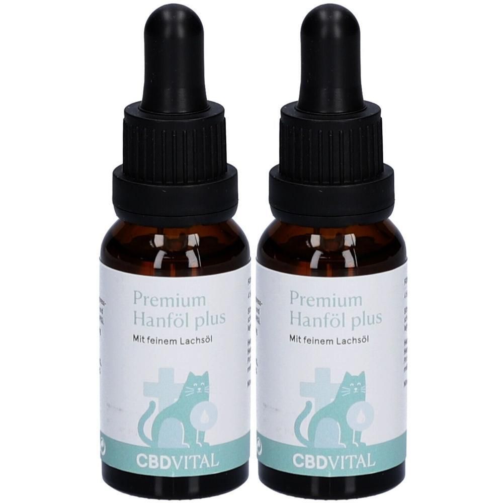 Zwei braune Glasflaschen mit schwarzen Pipetten. Aufkleber mit Text: Premium Hanföl plus, CBDVITAL, Katze.