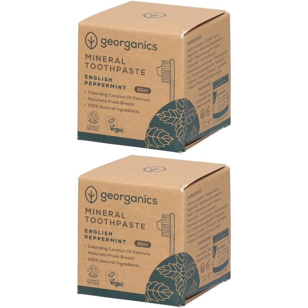 Zwei quadratische Pappschachteln. Aufschrift: georganics Mineral Zahnpasta, Englische Pfefferminze. Mit Illustrationen und Text.