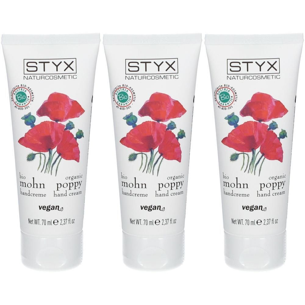 Drei Tuben STYX Naturcosmetic Mohn Handcreme mit Mohnblumen-Illustration. Vegan-Siegel und Bio-Siegel sichtbar.