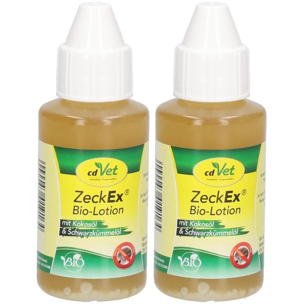 Zwei Flaschen cdVet ZeckEx Bio-Lotion. Braune Flüssigkeit in zylindrischen Flaschen mit weißem Deckel. Gelb-grüne Etiketten mit Produktnamen und Logo.