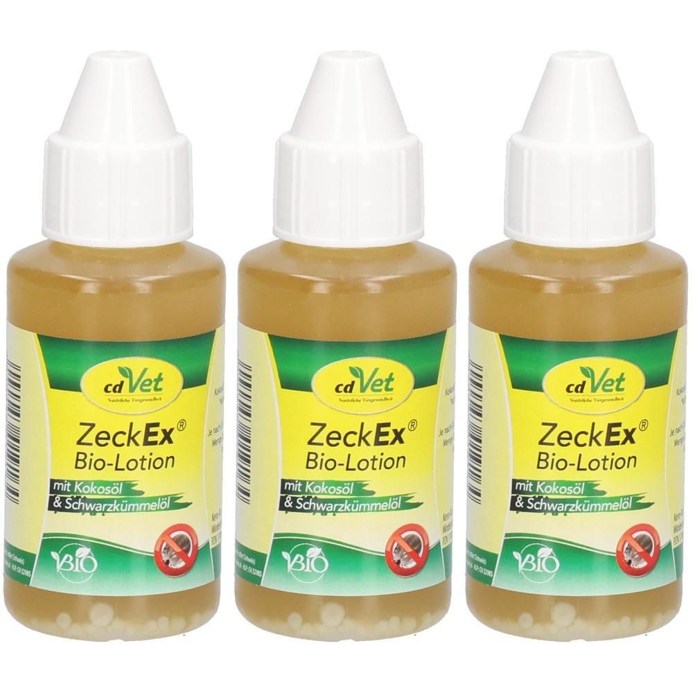 Drei Flaschen mit weißem Deckel und gelber Flüssigkeit. Aufschrift: ZeckEx Bio-Lotion, mit Kokosöl & Schwarzkümmelöl. Bio-Siegel.