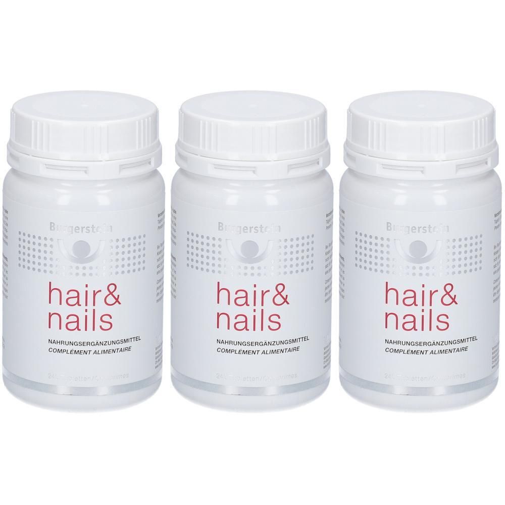 Drei weiße Flaschen mit Schraubverschluss. Auf jeder Flasche steht "hair & nails" in roter Schrift. Darunter steht "Nahrungsergänzungsmittel".