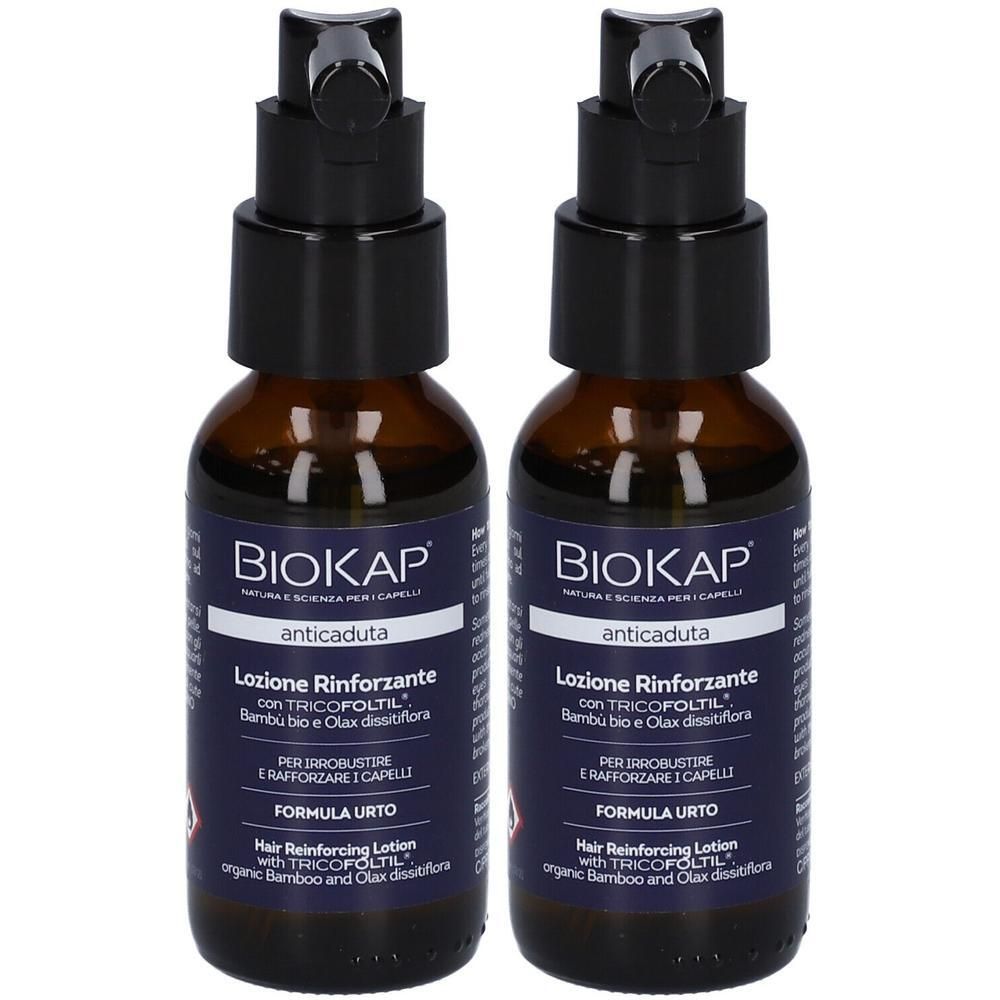 Zwei Flaschen BioKap© Anti-Haarausfall Stärkende Lotion mit Pumpspender. Dunkelbraune Glasflaschen mit dunkelblauem Etikett.