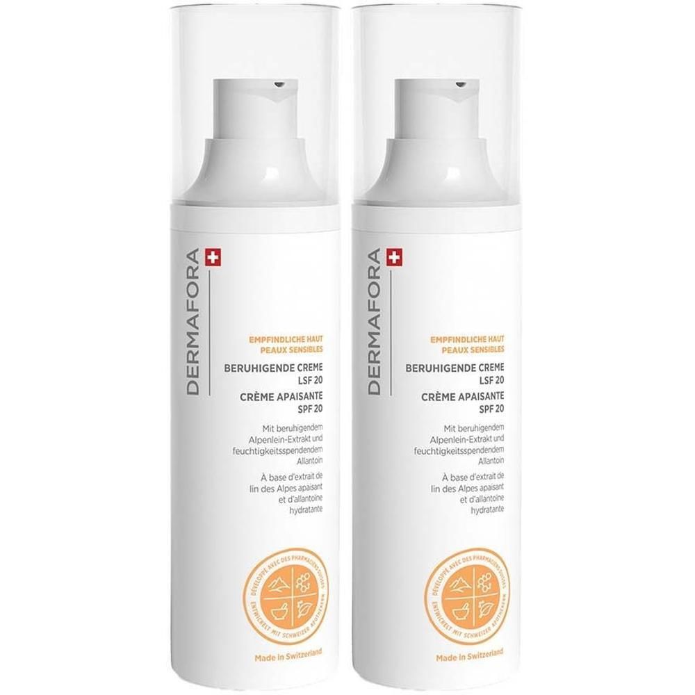 Zwei Flaschen DERMAFORA Beruhigende Creme. Weiße Flaschen mit Pumpaufsatz und Etikett. Schweizer Kreuz.
