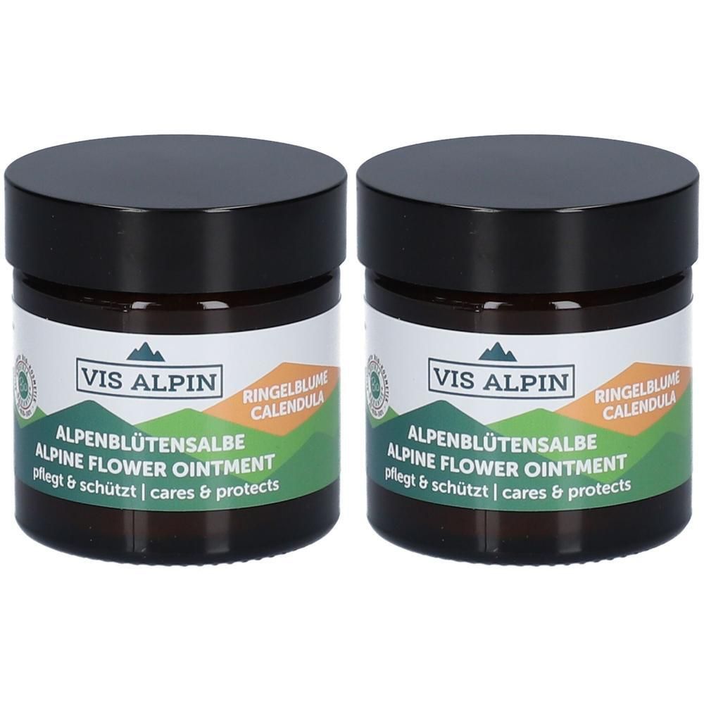 Zwei Tiegel Alpenblütensalbe mit schwarzen Deckeln. Auf den Etiketten steht VIS ALPIN, Alpenblütensalbe, Ringelblume, Alpine Flower Ointment.