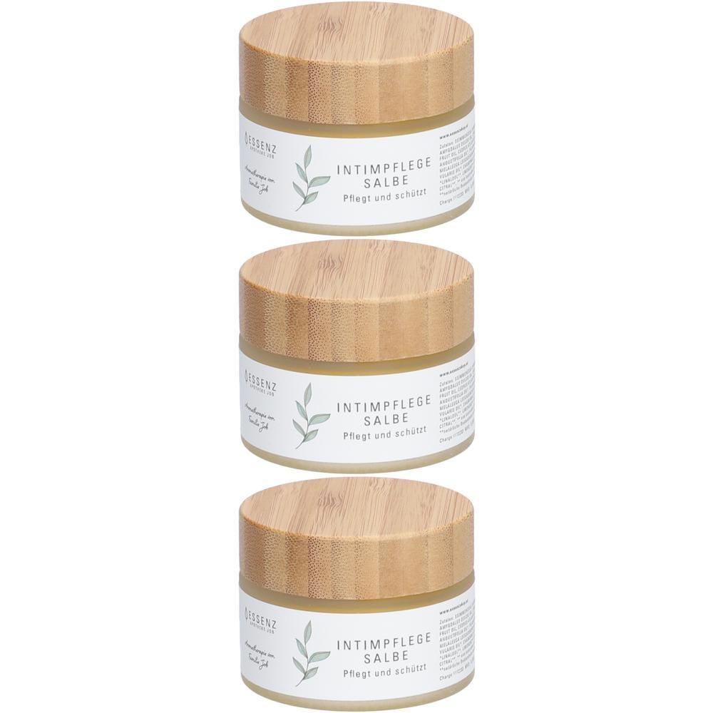 Drei Gläser Essenz Aromatherapie Intimpflege Salbe mit Holzdeckel.