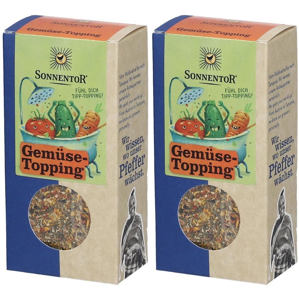 Zwei rechteckige Kartonverpackungen mit Gemüse-Topping. Aufdruck: SonnentoR, Gemüse-Topping, Illustration von Gemüse in Badewanne.