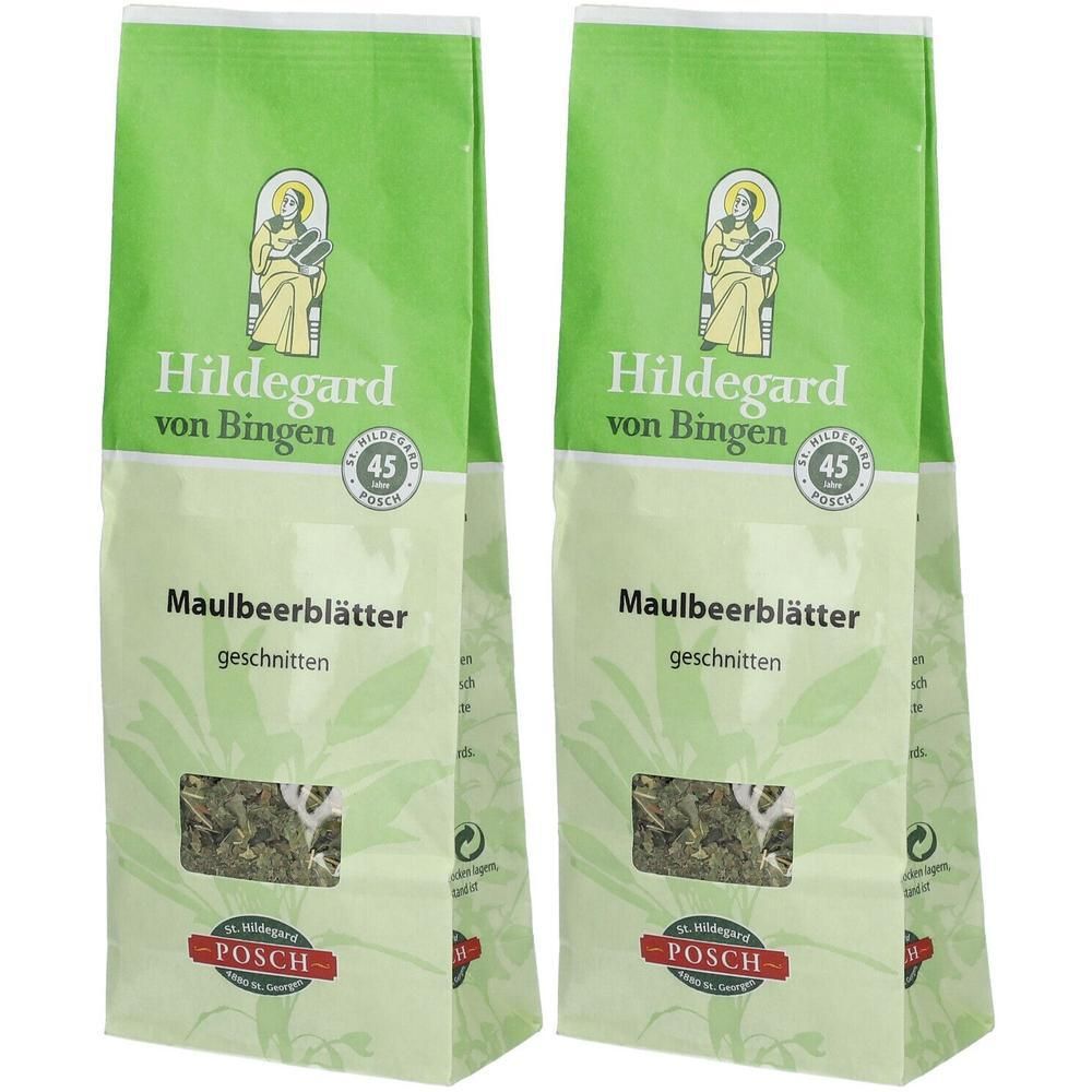 Zwei Beutel mit Maulbeerblättern. Grün-weiße Verpackung mit Logo und Produktbezeichnung. Sichtfenster zeigt Inhalt.