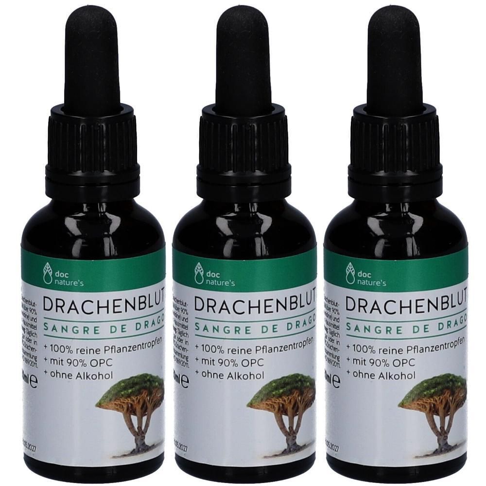 Drei Flaschen mit schwarzem Deckel und Pipette. Auf den Etiketten steht "DRACHENBLUT" und "SANGRE DE DRAGO".