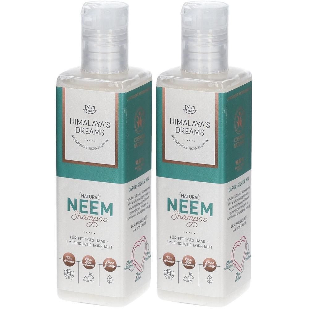 Zwei Flaschen Shampoo. Aufschrift: Himalaya's Dreams Neem Shampoo. Grün-weiße Verpackung mit Produktinformationen und Logos.
