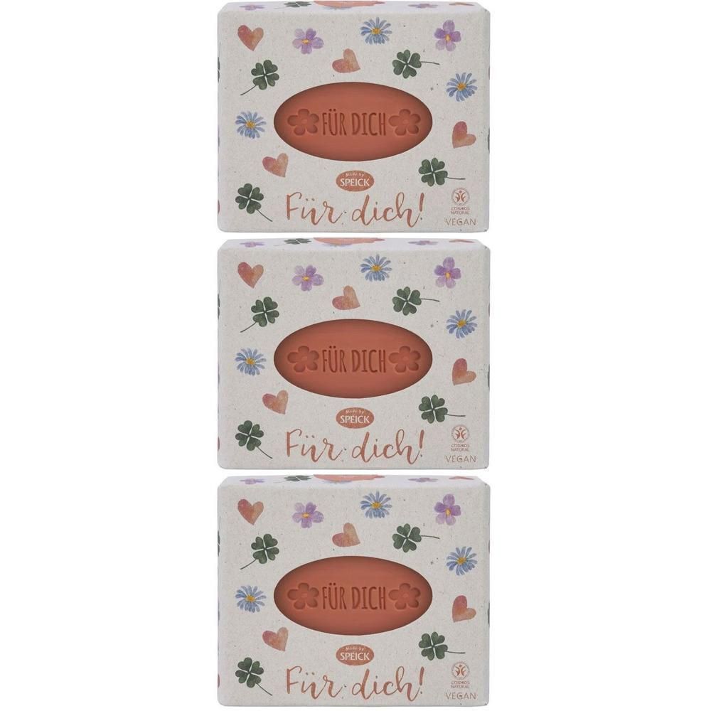 Drei Packungen Speick Seife mit Blumen- und Kleeblattmuster. Jede Packung zeigt eine orangefarbene Seife.