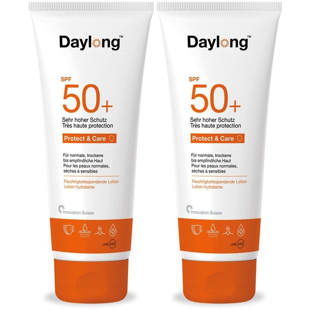 Zwei weiße Tuben Daylong Protect & Care Lotion LSF 50+ mit orangefarbenem Verschluss und orangefarbenem Streifen.