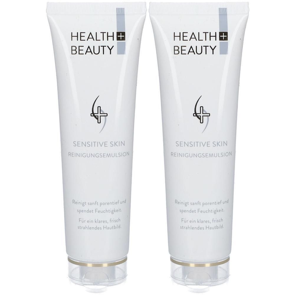 Zwei weiße Tuben mit Aufschrift HEALTH+BEAUTY und SENSITIVE SKIN REINIGUNGSEMULSION. Klare, transparente Verschlüsse.