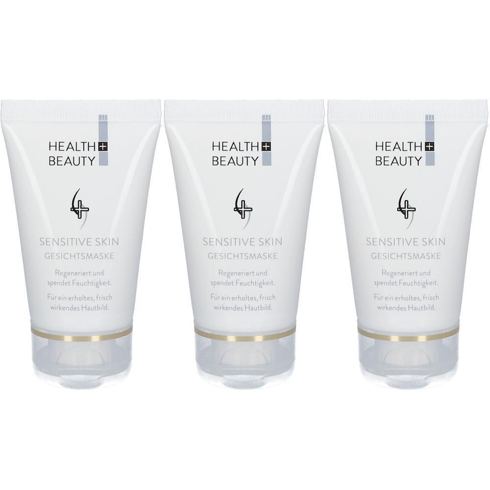 Drei Tuben Sensitive Skin Gesichtsmaske. Weiße Verpackung mit Logo und Produktbezeichnung. Klare, transparente Basis.