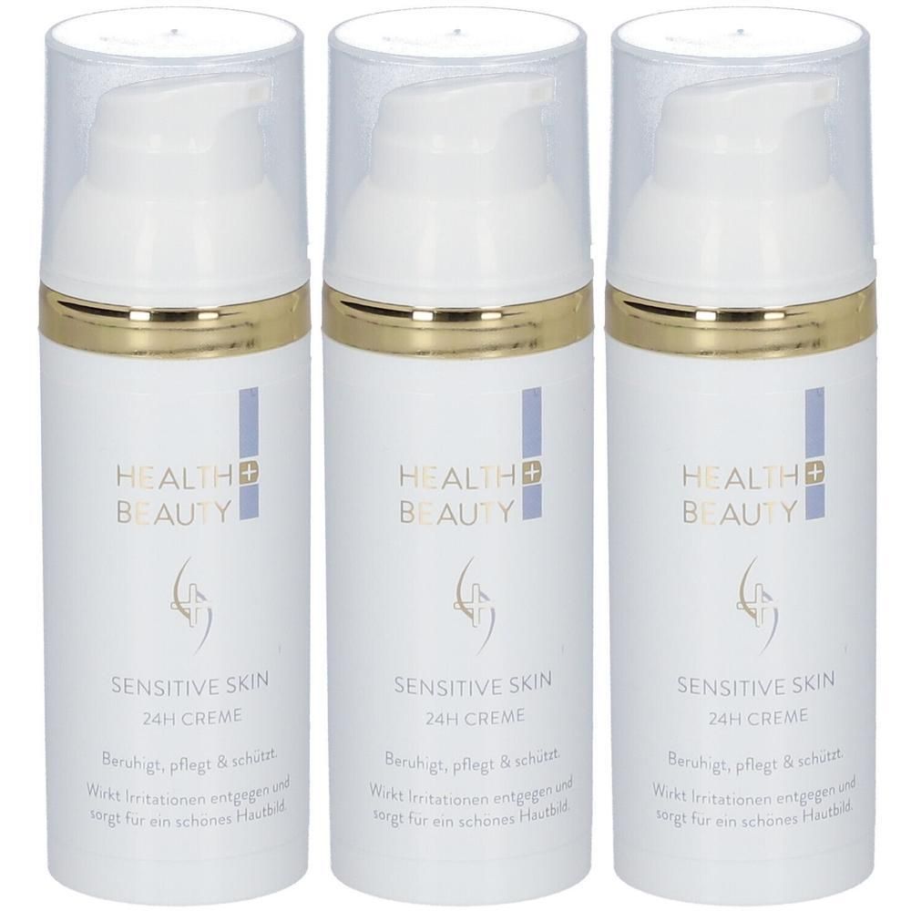Drei weiße Cremes mit goldenen Rändern und transparenten Deckeln. Aufschrift: Health & Beauty, Sensitive Skin 24h Creme.
