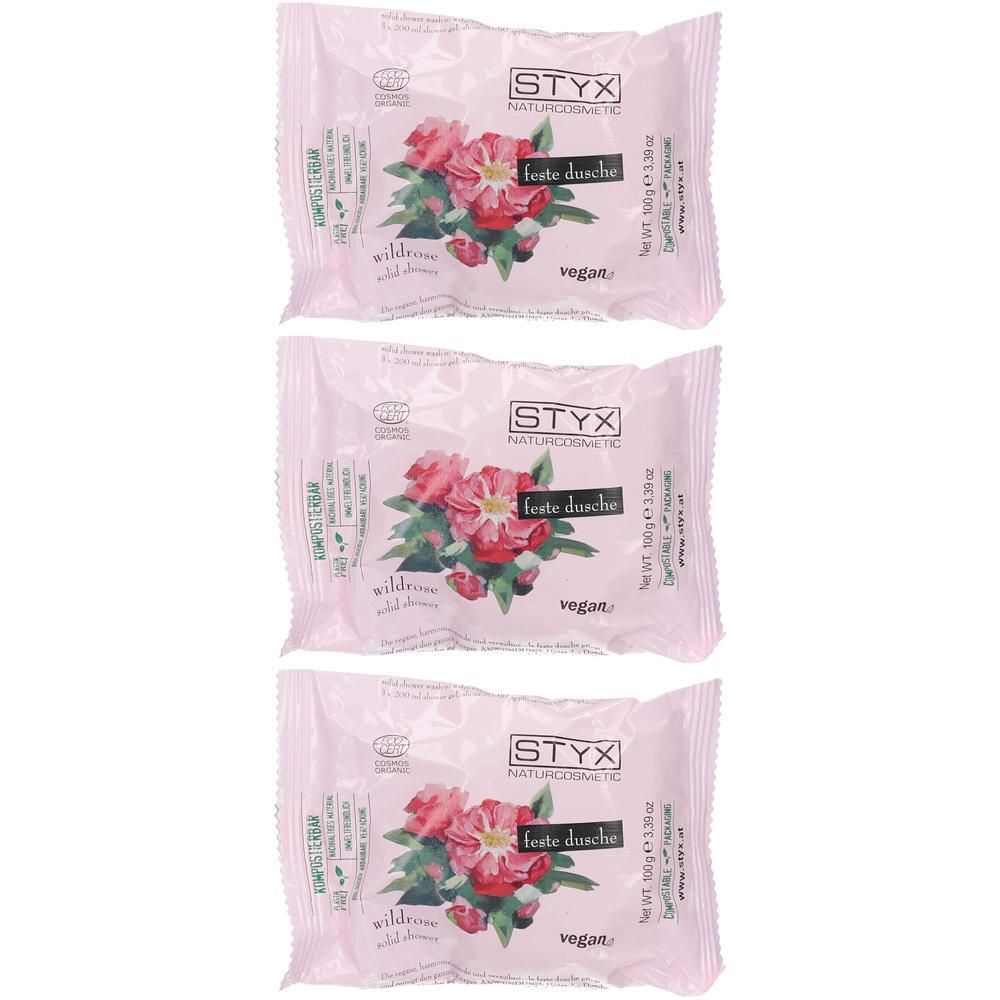 Drei feste Duschstücke von STYX mit Wildrosen-Motiv auf rosa Verpackung.