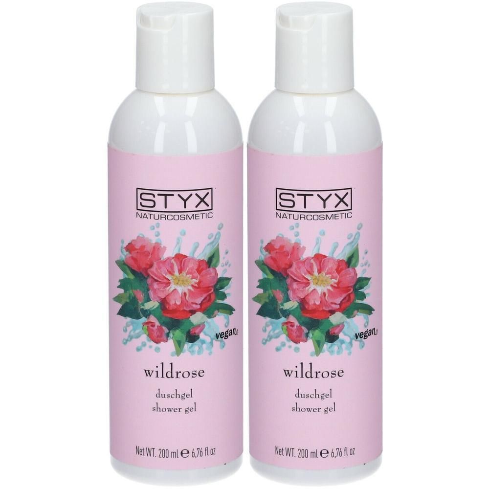Zwei Flaschen STYX Wildrose Duschgel mit Rosenmotiv und veganem Siegel.