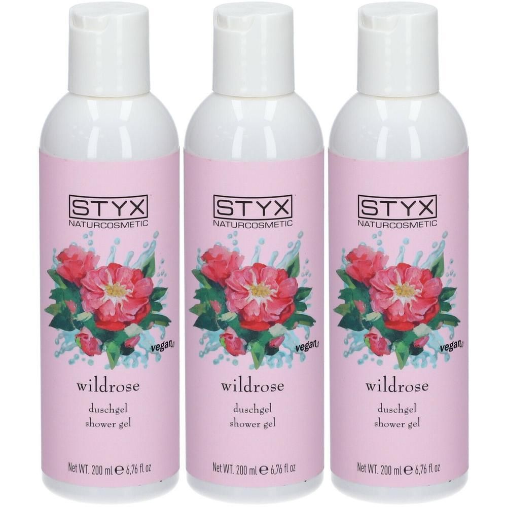 Drei Flaschen Duschgel mit rosa Etikett. Aufschrift: STYX Naturcosmetic, Wildrose, Duschgel, vegan. Weiße Kappe, rosa Hintergrund.